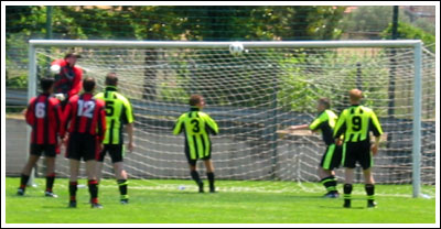 The Mancunian keeper flaps as the Pups attack in the semi-final.